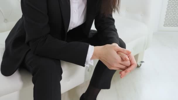Businesswoman nervously moving hands before meetting with psychologist in office — Stock Video