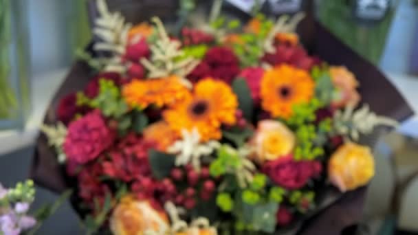 Beautiful bouquet of gerberas, roses, peonies and lilies of different colors. — Stock Video