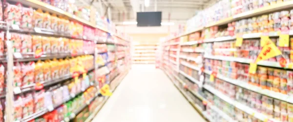 Abstract Blurred Supermarket Aisle Colorful Shelves Unrecognizable Customers Background — Stock Photo, Image