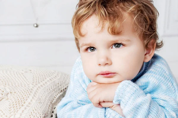 Portrait of happy adorable baby boy on the bed in his room. Atte — Stock Photo, Image