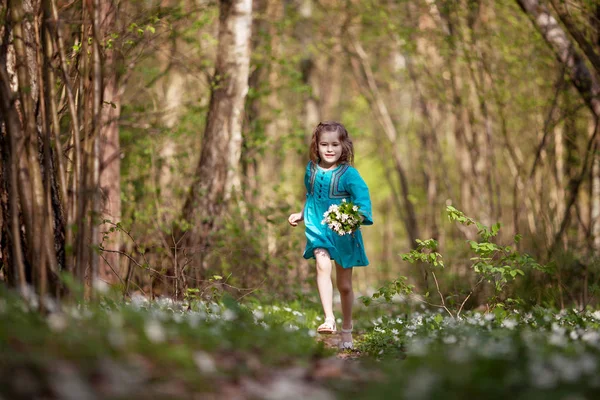 Little girl  taking a walk all alone in a park or forest.  Cute — Stock Photo, Image