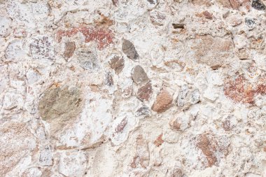 Taş duvar dokusu. Mozaik dekoratif duvar arkaplanını sallıyor. Eski taşlardan mason duvar. Evin dış duvarları dekoratif.. 