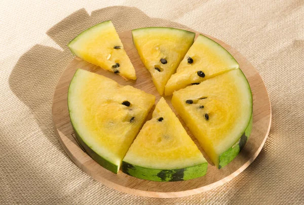 Yellow watermelon cut into wedges for the watermelon diet