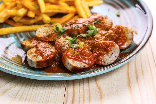 Fried sausages with French fries