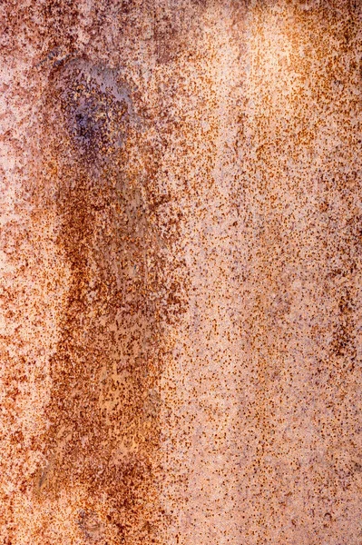 Fragment of a rusty iron sheet. Rusty metal texture