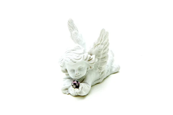 Uma Pequena Escultura Decorativa Uma Criança Anjo Segurando Algumas Pequenas — Fotografia de Stock