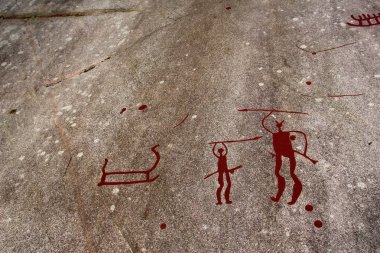 Avlanan erkekler ile önceden geçmiş bir resim. Çizim uzun zaman önce mağara adamları tarafından yapıldı.. 
