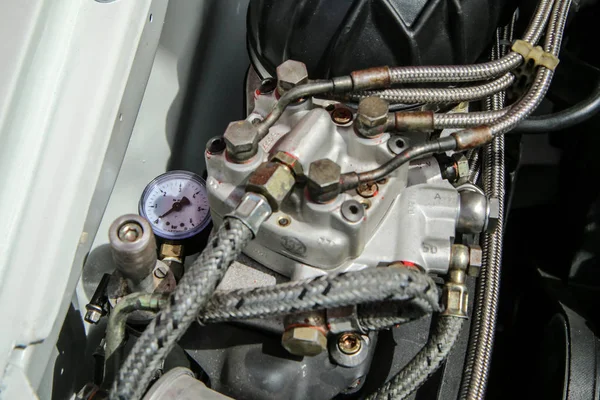 A detail of the sports car engine. It is a historic rallye car from the past.