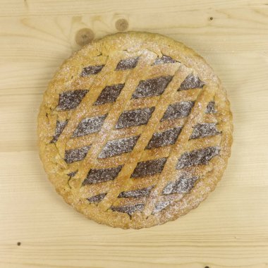 Ahşap arka plan - üstten görünüm üzerinde çikolata kremalı tart