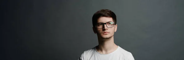 Portrait Pensive Teen Guy Dressed White Wearing Glasses Standing Black — Stock Photo, Image