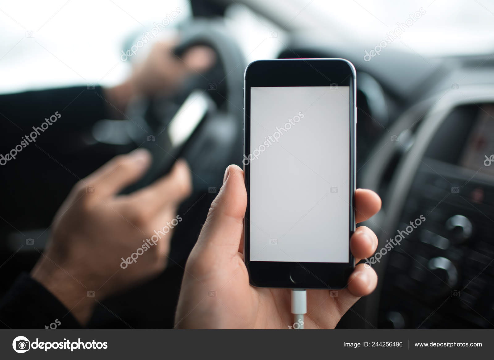 Download Close Up Hand Of Man Holding Smartphone With Mockup On Background Of Car Dashboard Stock Photo C Fedcophotography 244256496 PSD Mockup Templates