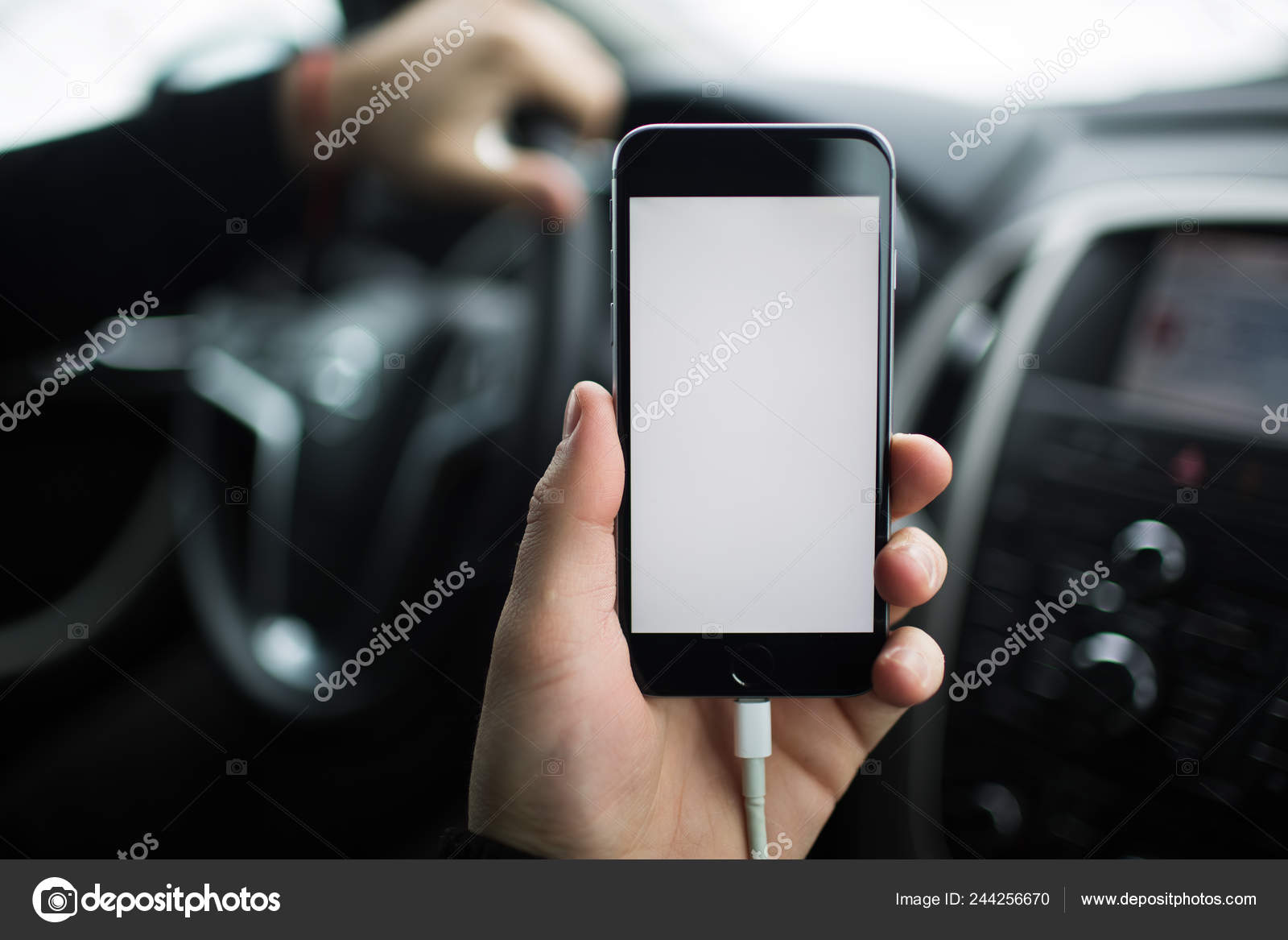 Download Close Up Hand Of Man Holding Smartphone With Mockup On Background Of Car Dashboard Stock Photo C Fedcophotography 244256670 PSD Mockup Templates