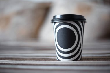 Black and white stripes on the cup of coffee. clipart