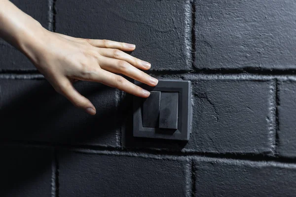 Close Female Hand Turning Light Electric Switch Button Background Black — Stock Photo, Image