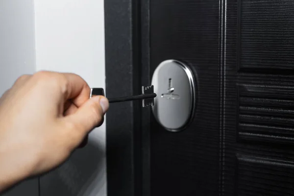 Close Male Hand Puts Key Keyhole Entry Door Apartment — Stock Photo, Image