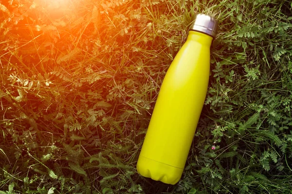 Download Stainless Thermos Water Bottle Matte Light Yellow Lemon Color Mockup Isolated On Green Grass Background With Sunlight Effect Single Metal Stock Photo 232906992