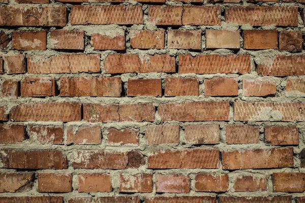 background texture of brick, with remnants of plaster