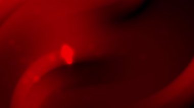 Kırmızı girdaplar ve parlak noktalar modern tasarım projeleri ve yaratıcı kavramlar için ideal dinamik ve gizemli bir karanlık zemin oluşturur..