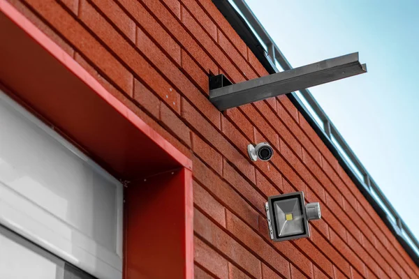 CCTV cameras on the wall. Monitor the security of a multi-story building or a private house. Security Agency