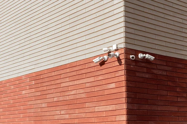 CCTV cameras on the wall. Monitor the security of a multi-story building or a private house. Security Agency