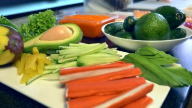 Close-up Vegetables Fruits Meat on Kitchen Table. Chef Cook Preparing Sushi At Restaurant. Food Ingredients For Cooking Meal