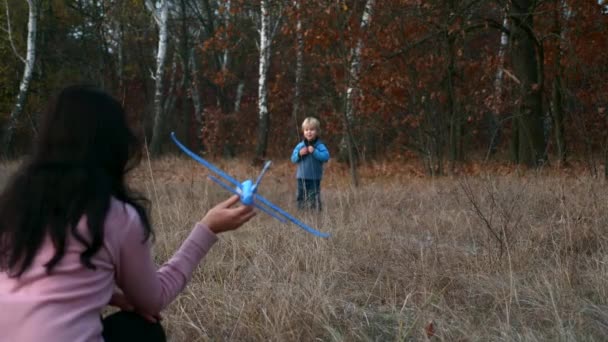 Mother Son Play Outdoors Launching Toy Plane Happy Boy Child — Stock Video