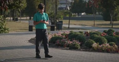 Teenage Boy Walk in Park 4K 10-bit 60fps Slow motion