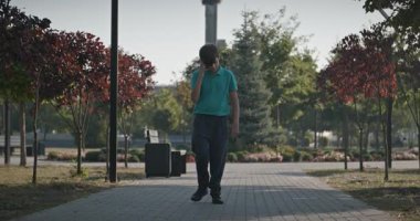 Teenage Boy Walk in Park 4K 10-bit 60fps Slow motion