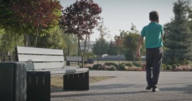 Teenage Boy Walk in Park 4K 10-bit 60fps Slow motion