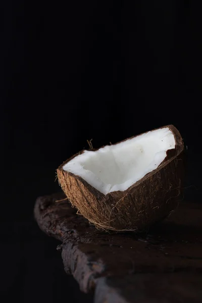 Close Ripe Aromatic Coconut Half Rough Wooden Table Black Background — Stock Fotó