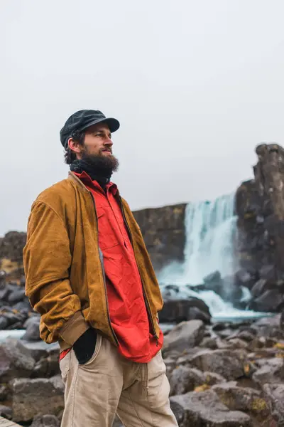 Handsome Bearded Man Looking Away While Standing Background Beautiful Waterfall — Stock Photo, Image