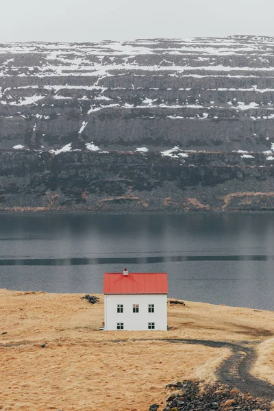 Remote house on terrain of lake coastline — Stock Photo, Image
