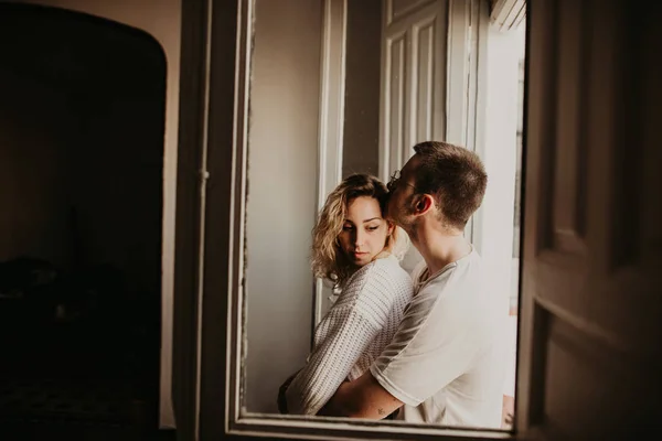 Romantic Couple Embracing Window Home — Stock Photo, Image