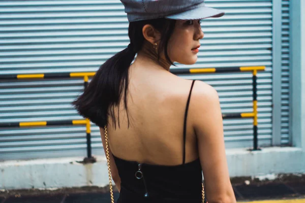Stylish Young Asian Woman Walking Metal Wall — Stock Photo, Image