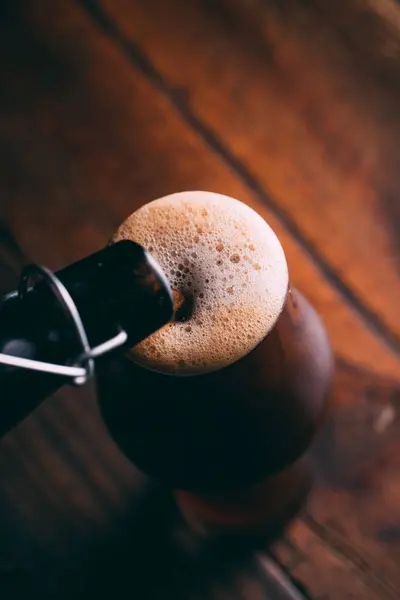 Pouring Stout Beer Glass Bottle Dark Wooden Background — Stock Photo, Image