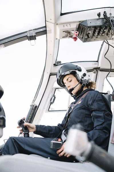 Focused Female Pilot Sitting Operating Helicopter — Stock Photo, Image