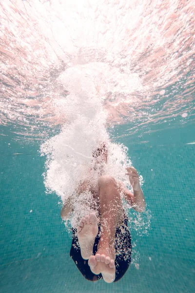 Unrecognizable Boy Swimming Trunks Diving Transparent Blue Pool Water — Stock Photo, Image