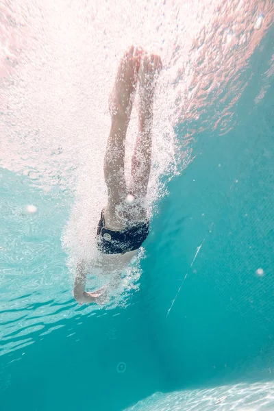 Boy Trunks Swimming Transparent Turquoise Deep Pool Raising Air Bubbles — Stock Photo, Image