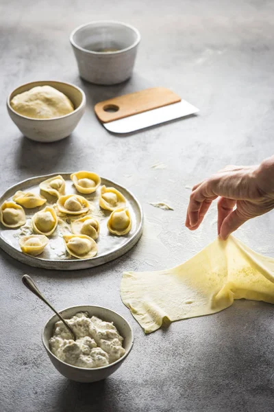 Human Hand Preparing Tortellini Cottage Cheese Grey Tabletop — Stock Photo, Image