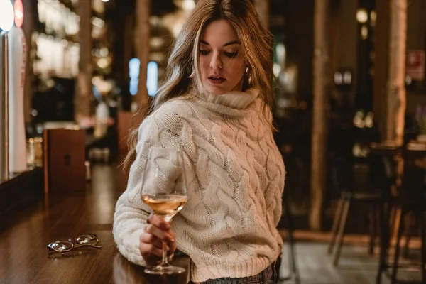 Stylish woman drinking wine in bar — Stock Photo, Image