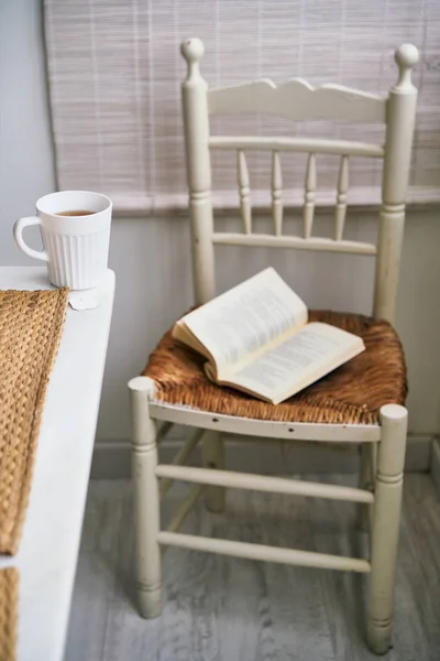 Comfortable Chair Open Book Placed Table Mug Fresh Tea Cozy — Stock Photo, Image