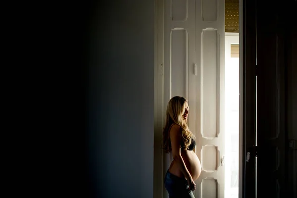 Thoughtful Pregnant Woman Bra Standing Open Door Home — Stock Photo, Image