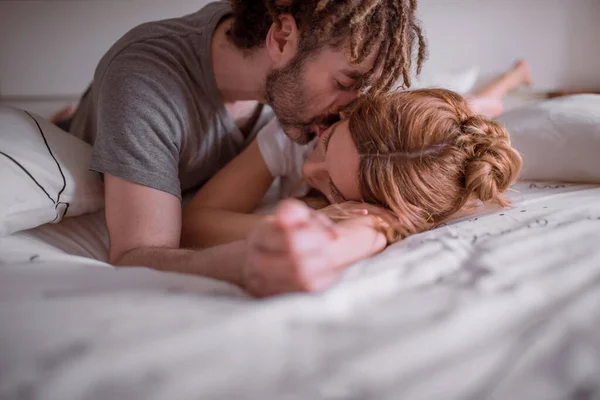 Tender Man Dreadlocks Hugging Kissing Woman Red Hair While Lying — Stock Photo, Image