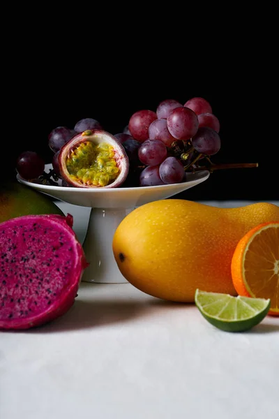 Still Life Tropical Fruits White Tablecloth Dark Background — Stock Photo, Image