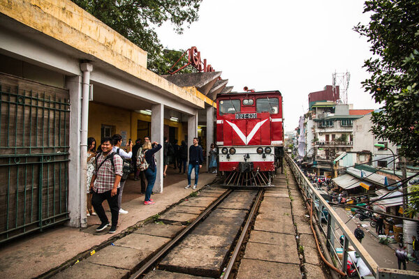  Red Train locomotive coming to Long Bien railway station, Hanoi, Vietnam