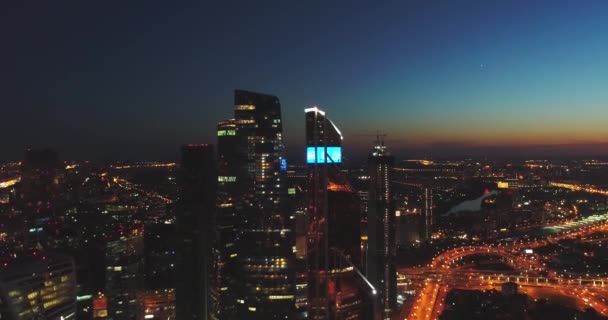 Night aerial view. Moscow City. View from above. City lights. Night panoramic shot on spring. Summer,4K — Stockvideo