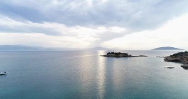Aerial drone video of sunset over the Aegean sea and Greek islands with beautiful clouds and colours, Greece, 4k 50fps