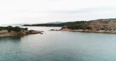 Aerial drone video of sunset over the Aegean sea and Greek islands with beautiful clouds and colours, Greece, 4k 50fps