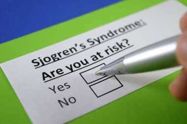 One finger is answering question about sjogren's syndrome. clipart