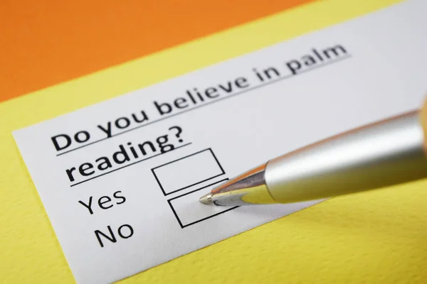 A person is answering question about palm reading.